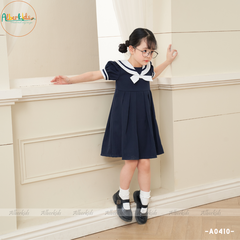 Váy bé gái xanh than đính nơ trắng A0410