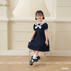 Váy bé gái xanh than đính nơ trắng A0410