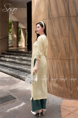 SONO - Áo dài vàng nhạt thêu hoa trắng lá xanh