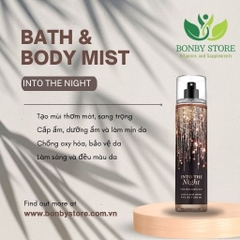 Một chai xịt toàn thân Bodymist Bath & Body Works màu đen có nhãn Into the Night