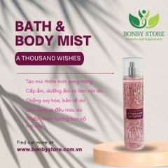 Một chai xịt toàn thân Bodymist Bath & Body Works màu vàng có nhãn A Thousand Wishes