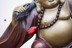 Tượng đồng Đức Phật Di Lặc kéo bao bố