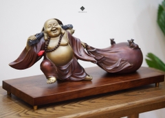 Tượng đồng Đức Phật Di Lặc kéo bao bố