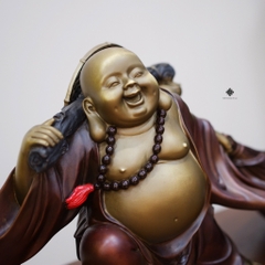 Tượng đồng Đức Phật Di Lặc kéo bao bố