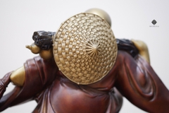 Tượng đồng Đức Phật Di Lặc kéo bao bố