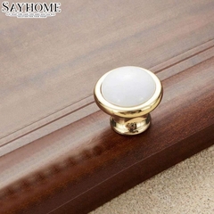 Núm tủ hiện đại màu vàng gold mặt sứ trắng SH9021