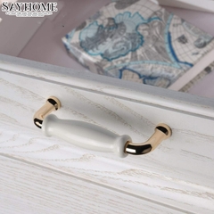 Tay nắm tủ hiện đại màu vàng gold mặt sứ trắng SH5537