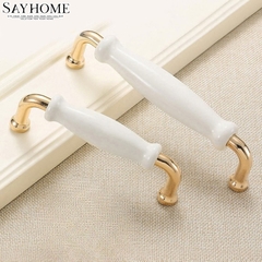 Tay nắm tủ hiện đại màu vàng gold mặt sứ trắng SH5537