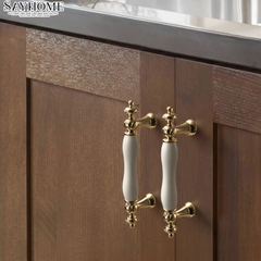 Tay nắm tân cổ điển Vintage màu vàng mặt sứ trắng SH2028