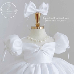 white-satin-baby-girl-princess-dress-with-puff-sleeves-pearl-neckline-and-bow-bo