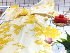 Đầm form dài xòe trễ vai nhúng nơ hoa văn màu vàng