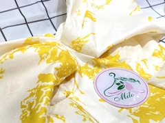 Đầm form dài xòe trễ vai nhúng nơ hoa văn màu vàng