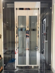 Thang Máy Tiêu Chuẩn Khung Thép Vách Kính