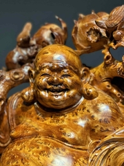 Tượng di lạc đứng bao tiền vàng gỗ nu ngọc am đẹp