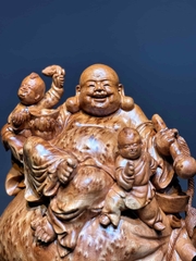 Tượng di lạc ngồi bao tiền vàng Gỗ Nu Ngọc Am thơm