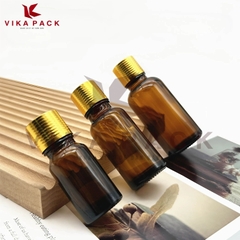 Chai thủy tinh đựng tinh dầu màu nâu nắp xoắn vàng