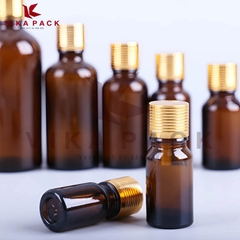 Chai thủy tinh đựng tinh dầu màu nâu nắp xoắn vàng