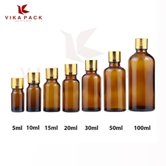 Chai thủy tinh đựng tinh dầu màu nâu nắp xoắn vàng