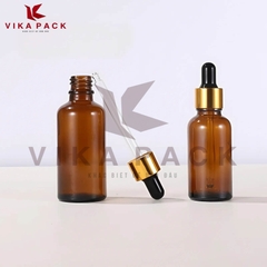 CHAI THỦY TINH ĐỰNG TINH DẦU MÀU NÂU NẮP BÓP VÀNG CAO SU ĐEN