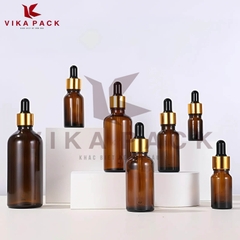 CHAI THỦY TINH ĐỰNG TINH DẦU MÀU NÂU NẮP BÓP VÀNG CAO SU ĐEN