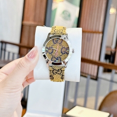 Gucci Multicolor G-Timeless |Nữ Giới |Mặt Tròn |Dây Vải Màu Vàng |Máy Pin (Quartz) |Size 38mm