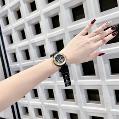Guess Cosmic |Nữ Giới |Mặt Vàng Gold |Dây Cao Su Màu Đen |Máy Pin (Quartz) |Size 36mm