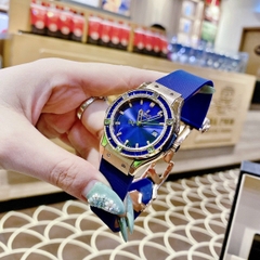 Hublot Geneve |Nữ Giới |Rose Gold |Đính Đá |Dây Silicone Xanh |Máy Pin (Máy Quartz) |Size 34mm