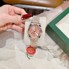 Rolex Date Just |Nữ Giới |Mặt Hồng |Niềng Khía |Dây Kim Loại Demi Vàng |Máy Pin (Máy Quartz) |Size 31mm