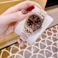 Rolex Date Just |Nữ Giới |Mặt Nâu |Niềng Khía |Dây Kim Loại Rose Gold |Máy Pin (Máy Quartz) |Size 31mm