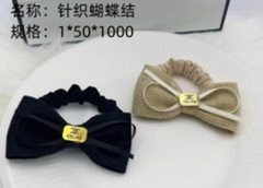 Dây buộc tóc thắt nơ trái tim thêu.