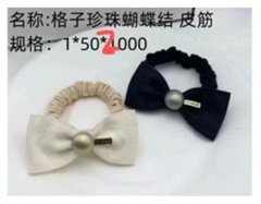 Dây buộc tóc thắt nơ kẻ caro đính ngọc trai.