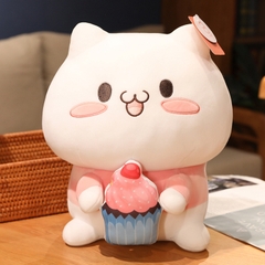 Mèo bông trắng cầm bánh