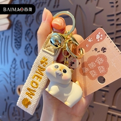 Móc khóa vàng hình mèo ngậm cá đáng yêu