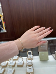 Lắc tay cỏ 4 lá trắng vàng 18K Italy 10 charm