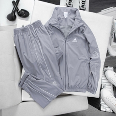 Bộ quần áo thể thao nam nữ Adidas đôi M10 Chất Gió cao cấp co giãn,túi quần áo có khóa, áo 2 lớp lót lưới, set thu đông