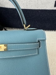 Kelly 25cm in imported Epsom grained leather, CC75 Blue Jean (denim blue) with gold hardware.