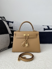 Kelly 25cm in imported Epsom grained leather, 0M Chai (milk tea) with gold hardware.
