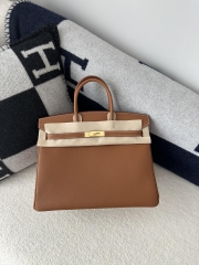 Birkin 35cm in imported Togo calfskin leather, CC37 Gold (classic brown) with gold hardware.