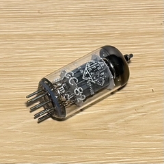 One Telefunken ECC82/12AU7 vacuum tube with logo on the bottom, ribbed long plate. 100% TV7 tested.