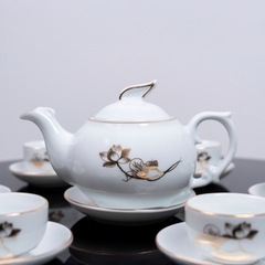 Bộ ấm chén sứ trắng hoa sen vàng