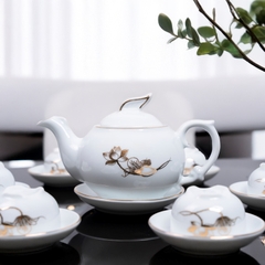 Bộ ấm chén sứ trắng hoa sen vàng