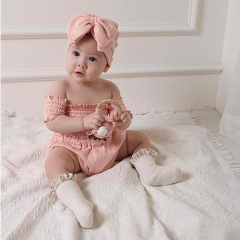 Set bodysuit cotton bo chun và nón nơ hồng