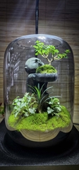 Bình "chú tiểu bưng chậu cây"