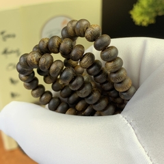 Vòng tay trầm hương Kỳ Hải Nam hạt bàn tính đơn tay nữ 6li nặng 4gram cận chìm dầu đen 050