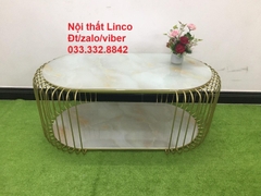 J2 Bàn sofa mặt kính oval 2 tầng 1m x 50 đặt tại sảnh chờ tiệm shop
