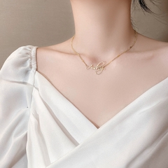 Dây chuyền titan mạ vàng chữ 2500487