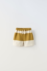 Quần shorts xanh vàng