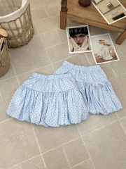 Chân váy bí phồng chấm bi xanh