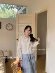 Áo kiểu  thô cổ tròn buộc nơ ren gấu chân áo