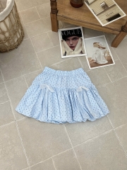 Chân váy bí phồng chấm bi xanh